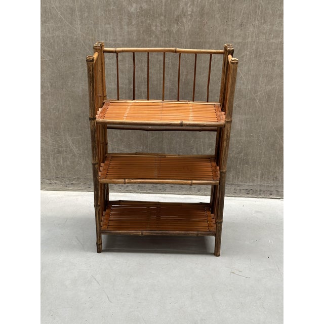 Meet this exceptionally charming 1960s vintage bohemian-style wall unit, beautifully crafted from natural rattan and...