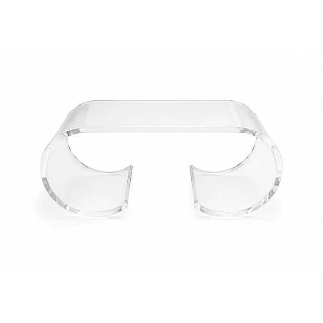 1970s Lucite coffee table featuring a sculptural continuous scroll form in the style of Karl Springer. Formed from...