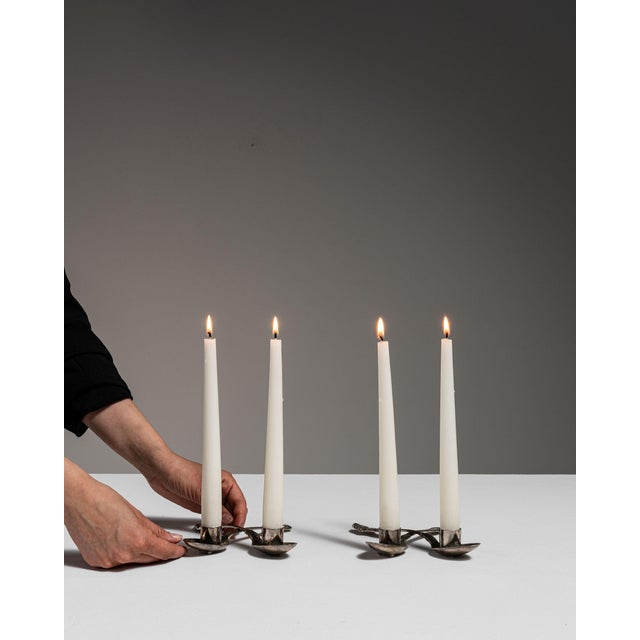 This early 20th century candlestick from France is finished in black, worked in silver. Its form follows honest, well-...