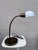 A beautiful example of mid-century American task lighting that's as functional as it is good-looking. This brass gooseneck...
