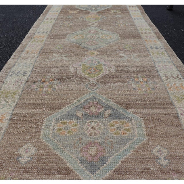 Turkish Oushak Runner With Soft Brown Field and Pale Blue Geometric Medallions For Sale - Image 10 of 12