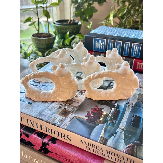 Perfect for spring and summer entertaining, these porcelain napkin rings sport happy frogs on a branch with lily pads...