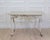19th Century French Painted Iron Table witAn elegant 19th century French painted iron table featuring graceful cabriole...