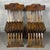 A pair of Savonarola-style folding chairs attributed to 20th-century Italian craftsmanship, made of solid wood with a...