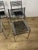 Set of four Sandows 101 chairs with a steel frame and elastic cord seat and backrest, designed by René Herbst and made in...