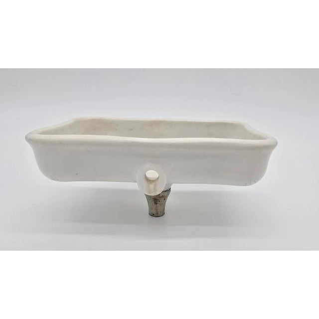 Description: Made of porcelain Republic logo in center of dish Pedestal mount Condition: Excellent Minor signs of age and...