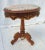 Beautiful marble top side / end / side table. Nice oval top with pink marble. Brass ormolu decorated around the top and...