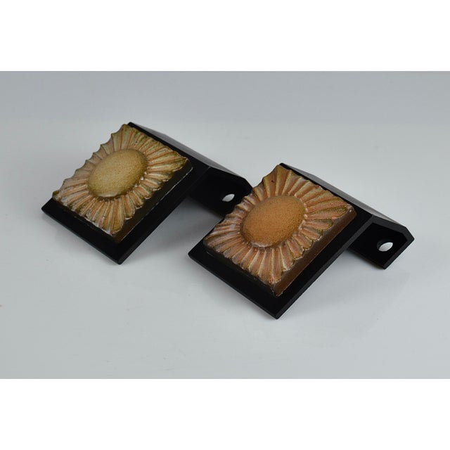 Pair of decorative Mid-Century door handles, dating from circa 1950. Each handle features a square ceramic tile with a...