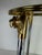 This is a vintage glamorous brass and chrome martini table. This martini table has brass feet that are cast in the form of...