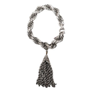 Vintage 1960s Signed Monet Rhodium Plated Tassel Charm Bracelet For Sale