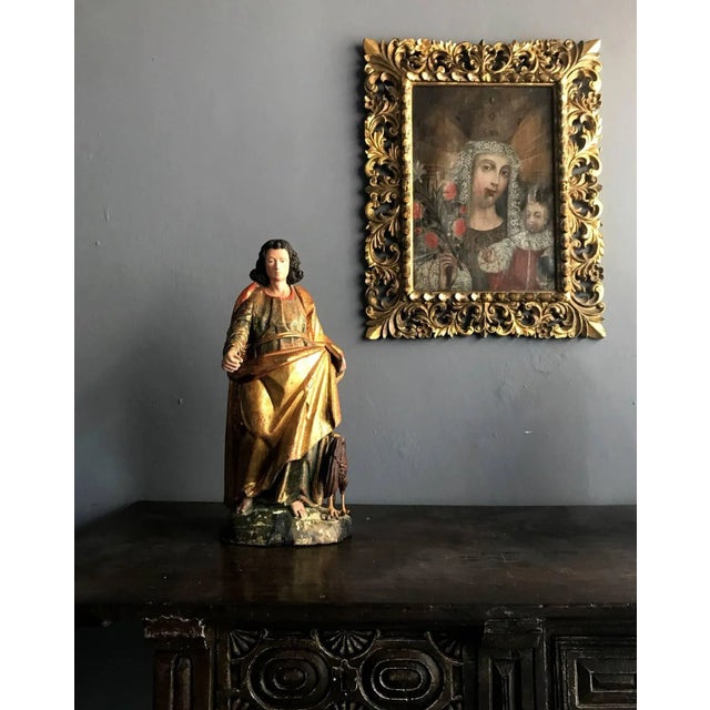 A stunning antique parcel-giltwood statue of St. John, 19th century, possibly earlier, from Mexico, Spanish Colonial with...