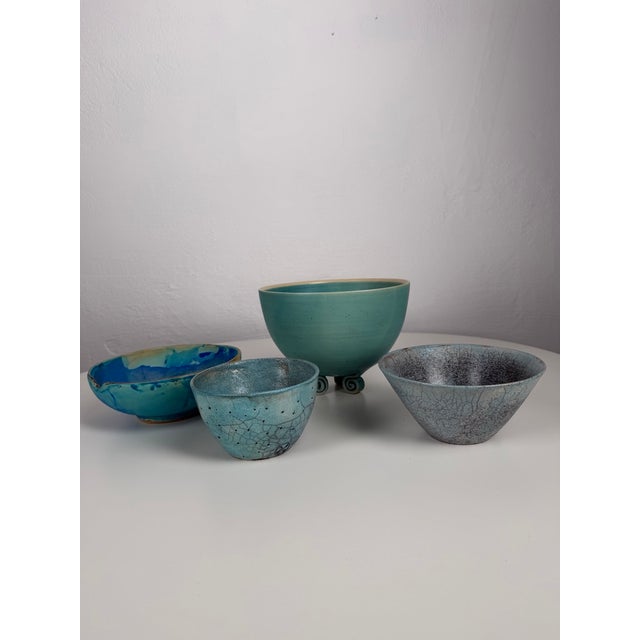 Set of four handmade ceramic bowls originating from an art pottery studio. Each piece is unique, individually formed and...