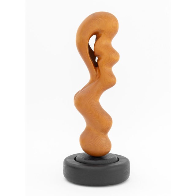 Modernist Biomorphic Carved Wood Revolving Sculpture, mounted on an ebonized wood base. Overall: 20" H x 7.5" Diameter....