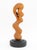 Modernist Biomorphic Carved Wood Revolving Sculpture, mounted on an ebonized wood base. Overall: 20" H x 7.5" Diameter....