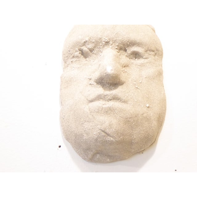 Cast plaster head, sandy finish, hangs on nail against wall, signed by Neal Beckerman, 10"H x 6.5"W x 3.5"D.