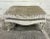This is an absolutely gorgeous Louis XV ivory carved ottoman with striped fabric. Painted and distressed legs,...