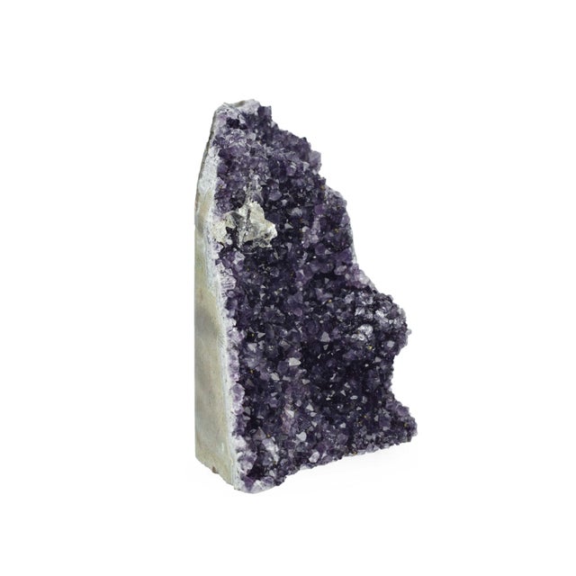 This decorative purple quartz geode is a unique piece that brings the wonders of the natural world indoors. Its...