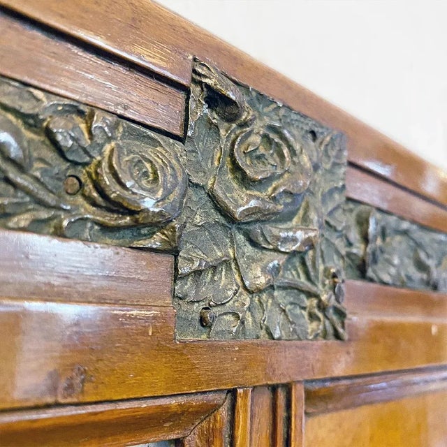 Italian mid-century wood and brass details dresser mirror, 1950s Dresser mirror with wooden structure with embossed brass...