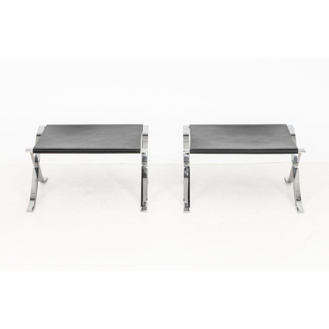 Pair of Mies van der Rohe for Knoll Studio Barcelona Stools with Cowhide Slings, in black on chrome-plated X-form base and...