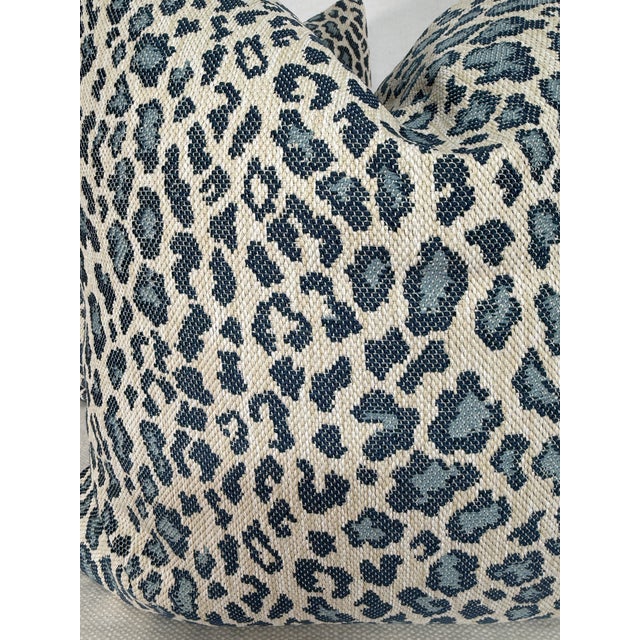 Custom pair of 22" pillows covered in Cowtan & Tout "Mala" in blue indoor/outdoor fabric. These pillows have tapered...
