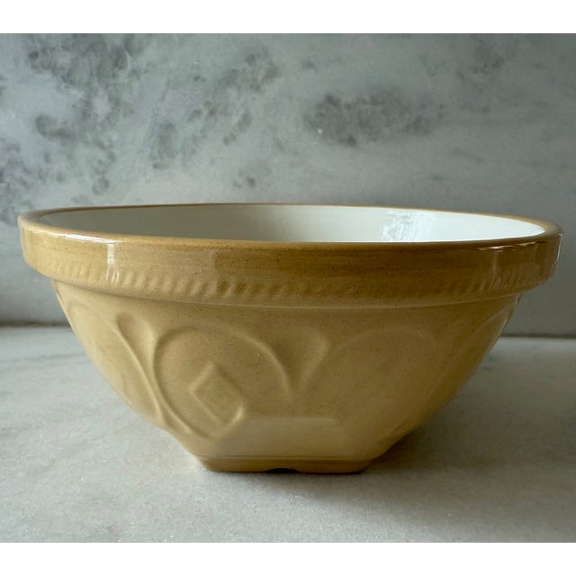 Vintage butter yellow and cream stoneware Gripstand mixing bowl made in England by T.G. Green circa 1930s. Bowl features...