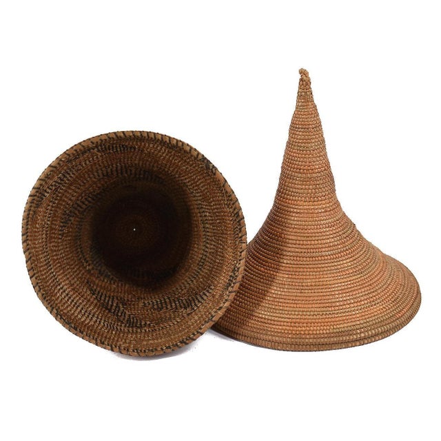The Tutsi Tight Weave Basket with Lid from Rwanda epitomizes the artistry and tradition of the Tutsi community's weaving...