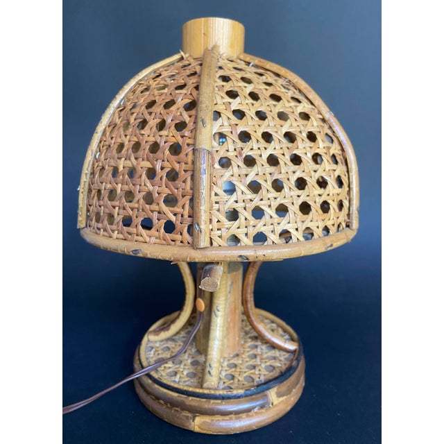 Sculptural bamboo and rattan table lamp attributed to Louis Sognot, France, circa 1960s. This highly decorative piece...