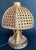 Sculptural bamboo and rattan table lamp attributed to Louis Sognot, France, circa 1960s. This highly decorative piece...