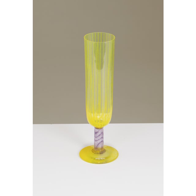 A vintage hand-blown glass flute designed by Kjell Engman for Kosta Boda, Sweden. It belongs to the Bon Bon series, which...