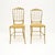 A gorgeous pair of vintage Italian Chiavari dining chairs in solid brass. They were made in Italy and date from around the...