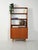 Scandinavian teak bookcase from the 1950s/1960s with a lower cabinet, exposed shelves, and brass tips. Scandinavian teak...