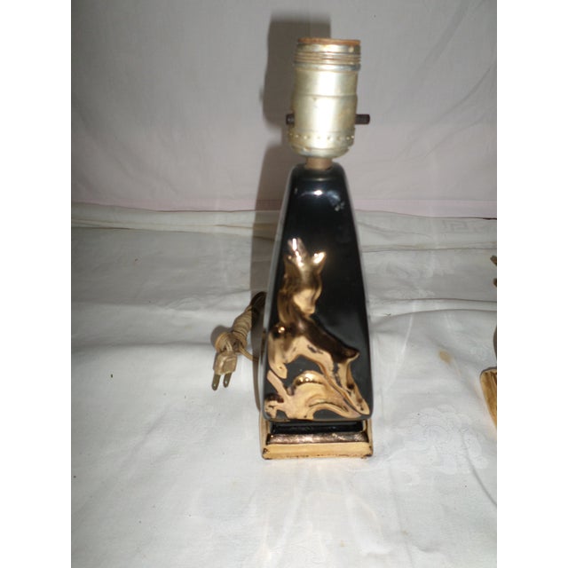 This is a Wonderful! Vintage Pair of Art Deco Table Lamps in Black with Gold Gazelle Design in a Very Glossy Finish and...