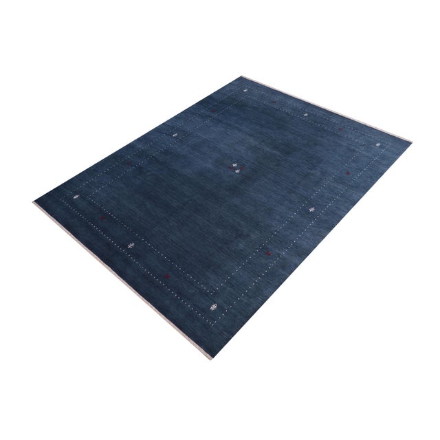 Make a bold statement in your living area with this exquisite Contemporary Gabbeh Wool Rug. It is meticulously hand-...