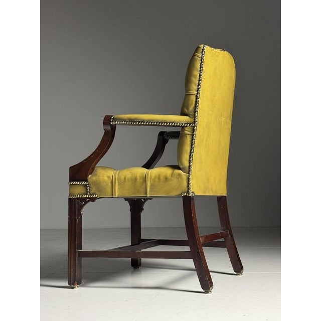 Classic office chair / armchair, mid-20th century. Upholstered in green leather. Button-tufted seat and back. In very good...