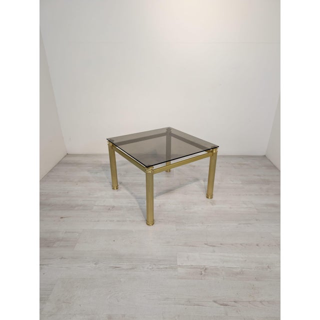 This unique Hollywood Regency coffee table from the 1970s is a perfect example of elegant design inspired by luxury and...