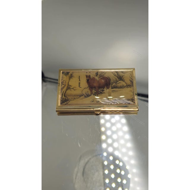 Pre-war brass gilded business card holder, dimensions: height: 5.7 cm, width: 9.3 cm, depth: 0.6 cm.