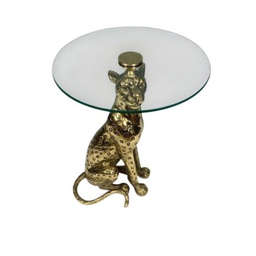 A striking and highly decorative Hollywood Regency style leopard side table, crafted in gilt metal and topped with a...