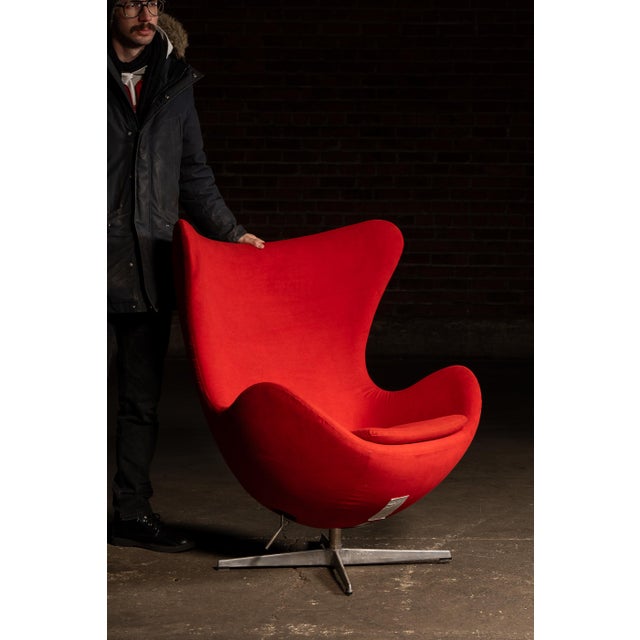 Iconic sculptural lounge chair designed after those by Arne Jacobsen, commonly known as the Egg Chair, featuring a high...