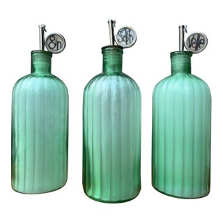 Vintage Green Decanter Bottles With Metal Siphon Discs and Monogram Discs - Set of 3 For Sale
