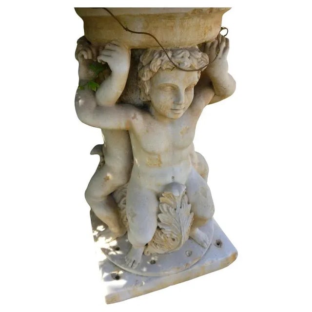 Centerpiece fountain with an octagonal basin in Rosso Verona marble and Greco Thassos marble. Water flows from the center...