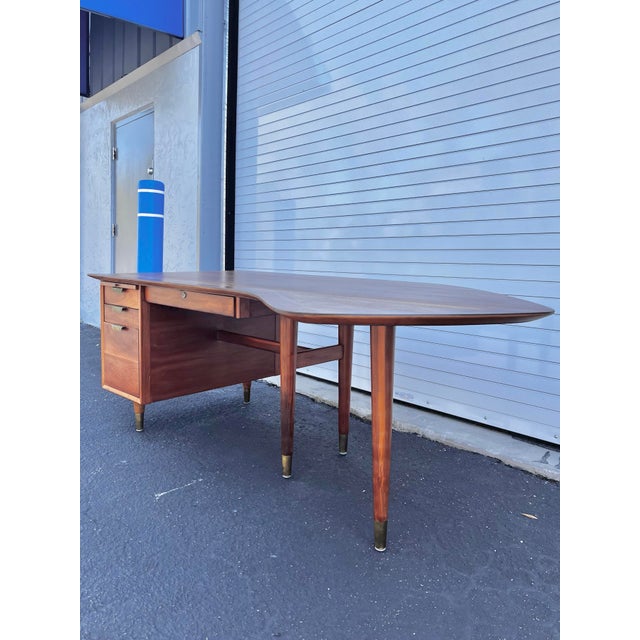 Walnut boomerang executive desk with conference corner. Mid-Century modern by William H Sullivan for Standard Furniture....