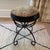 Chic vintage wrought iron stool featuring an unusually decorative looping and scrollwork base. The round upholstered seat...