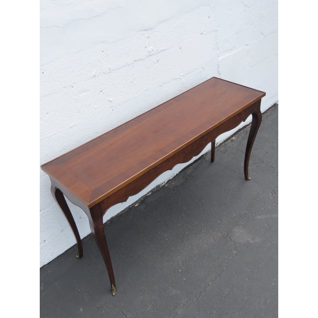 This beautiful Console Table is made out of wood, solid wood, veneer, and bronze. This gorgeous Console Table has a...