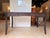Elevate your workspace with this sophisticated contemporary writing desk, crafted in a rich espresso wood finish with...