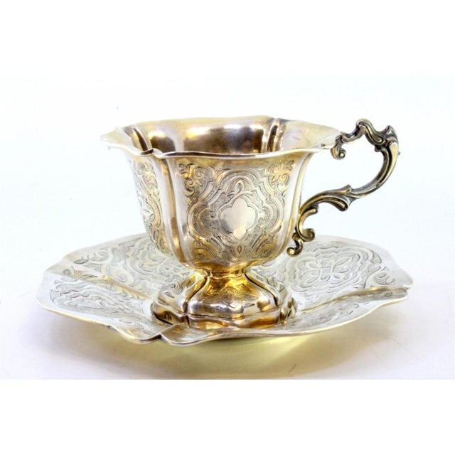 Silver Cup and Saucer with Engraved Floral Motifs and Edge Cutouts, Set of 2, in Very Good conditions. Designed before...