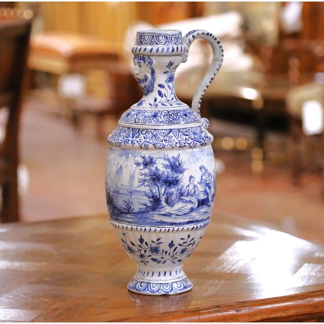 Bring classic European charm to a buffet, console, or dining-room display with this elegant antique French faience ewer,...
