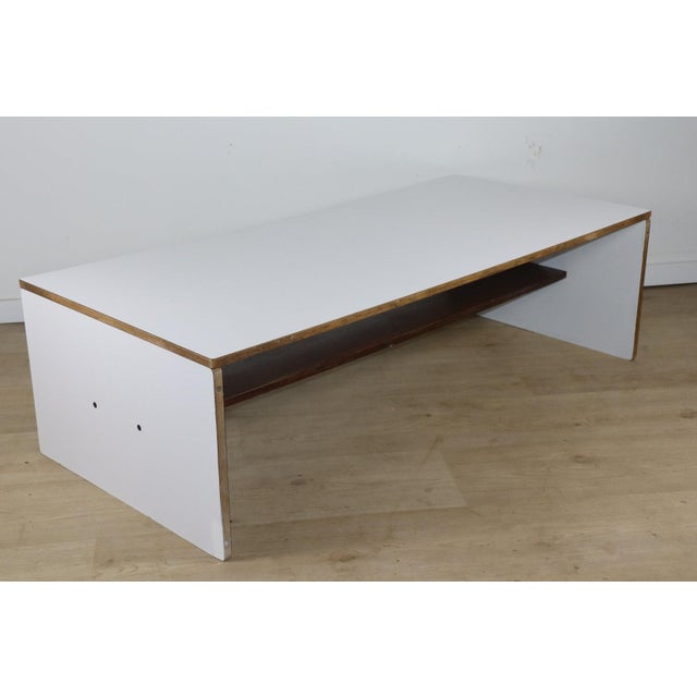 Modular coffee table designed by Pierre Guariche, originally for the La Plagne ski resort in the 1970s. It perfectly...