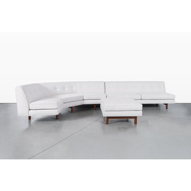 Add a touch of mid-century charm to your living space with this inviting sectional sofa, designed by Edward Wormley for...