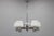 This elegant art deco chandelier originates from czechoslovakia in the 1930s and showcases a finely proportioned nickel-...