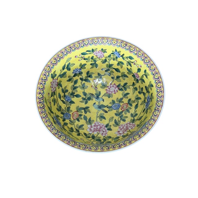 This is a lovely Andrea by Sadek porcelain bowl in yellow, with a floral pattern featuring peonies, chrysanthemums, birds...